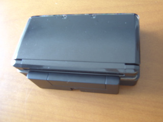 The 3ds on its charger stand